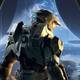 The Master Chief stands with his back toward the camera while looking at the Halo ring's environment.